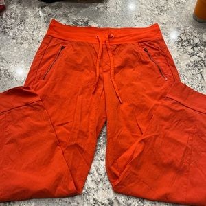 Athleta orange Trekkie joggers size 8